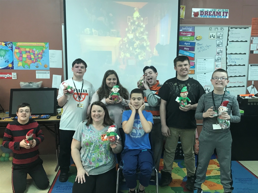 kids holding elf stuffed animals